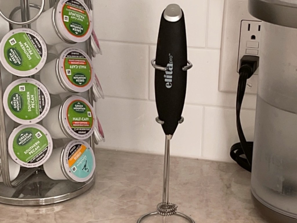 milk frother in stand on countertop