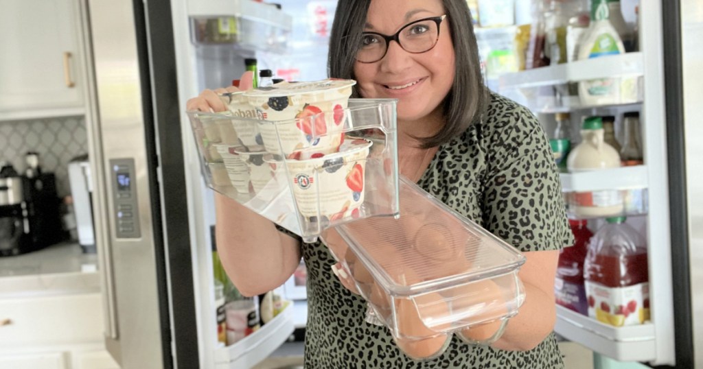 woman organizing the fridge