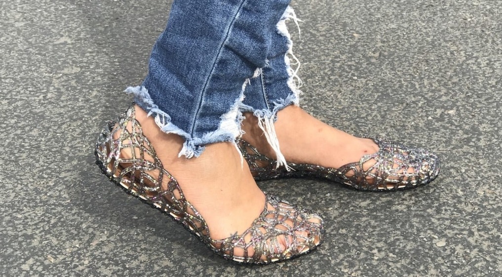 woman wearing glitter jellies