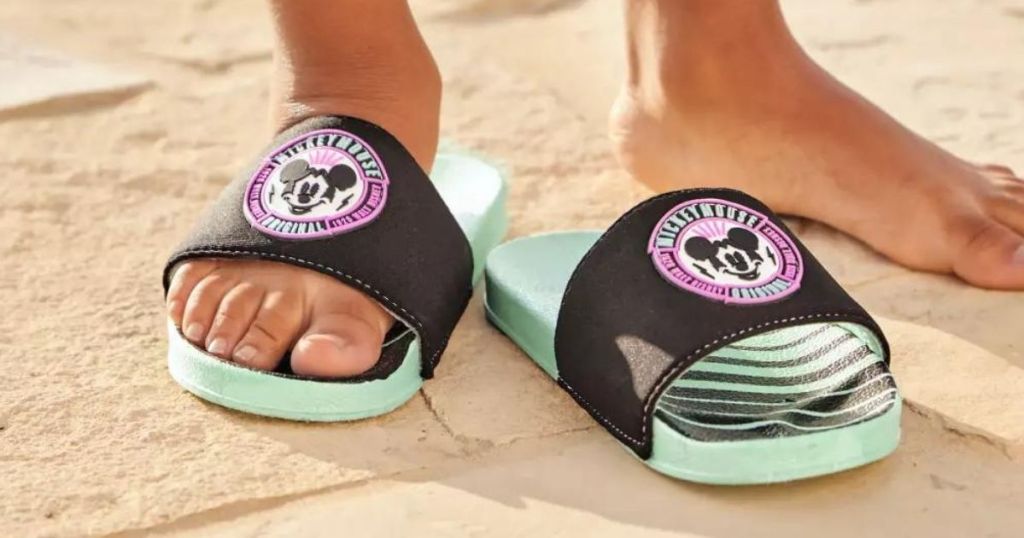 kid wearing Disney Mickey Mouse Slides