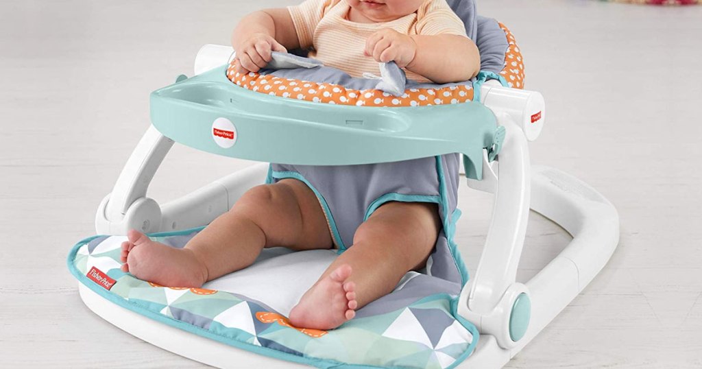 baby sitting in Fisher-Price Sit-Me-Up Floor Seat