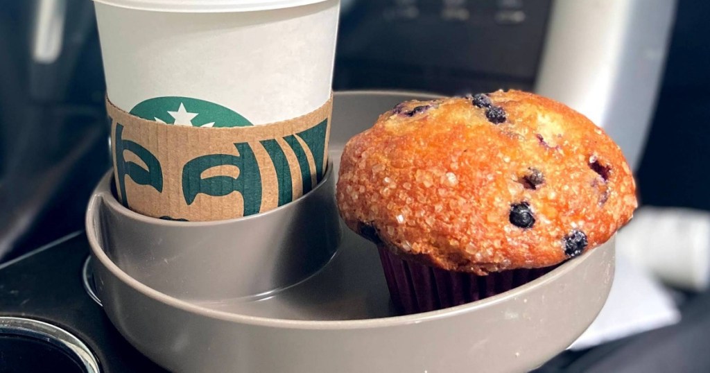 coffee and muffin in gray travel tray