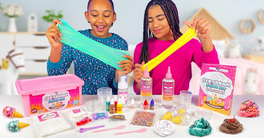 two girls playing with ice cream slime kit