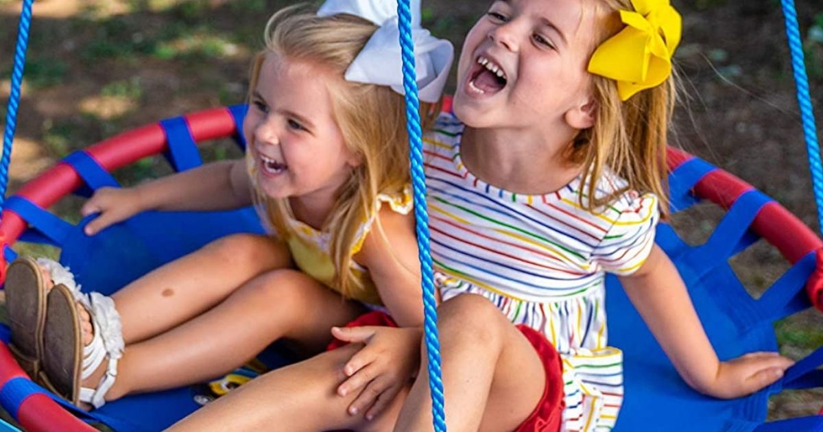 kids on a round swing