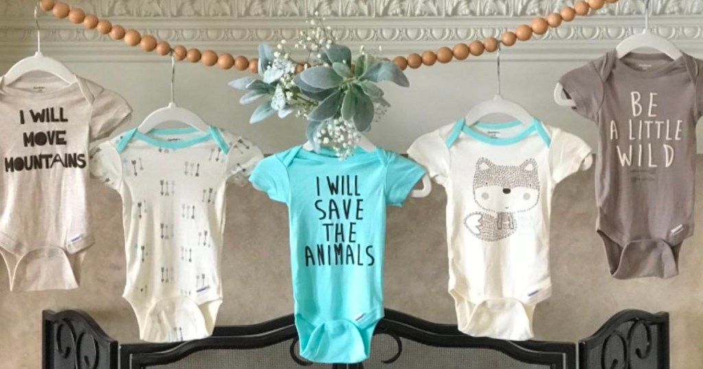 gerber animal onesies hanging on garland 