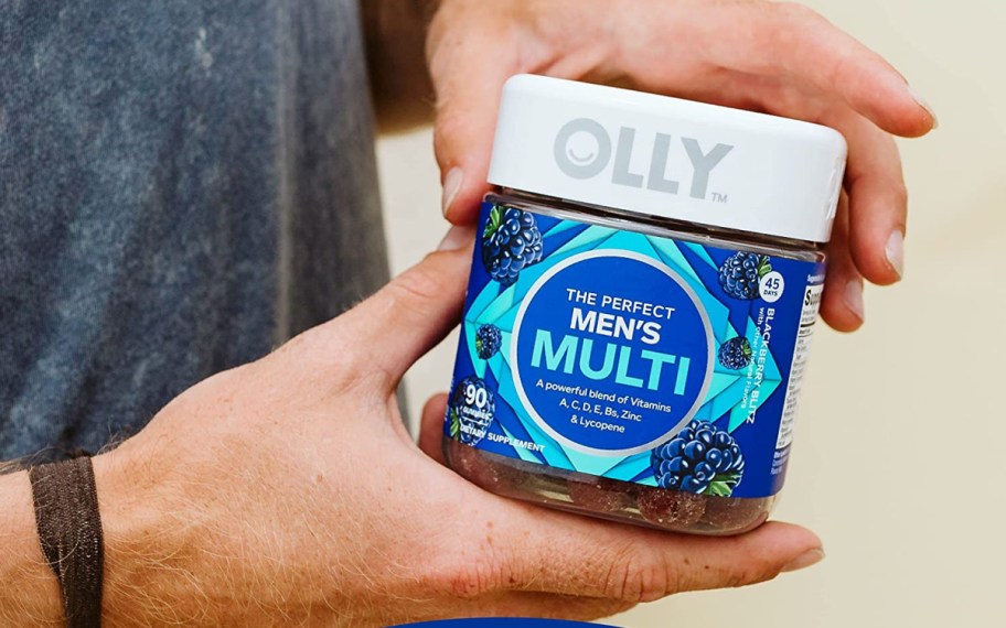 hands holding olly mens gummies