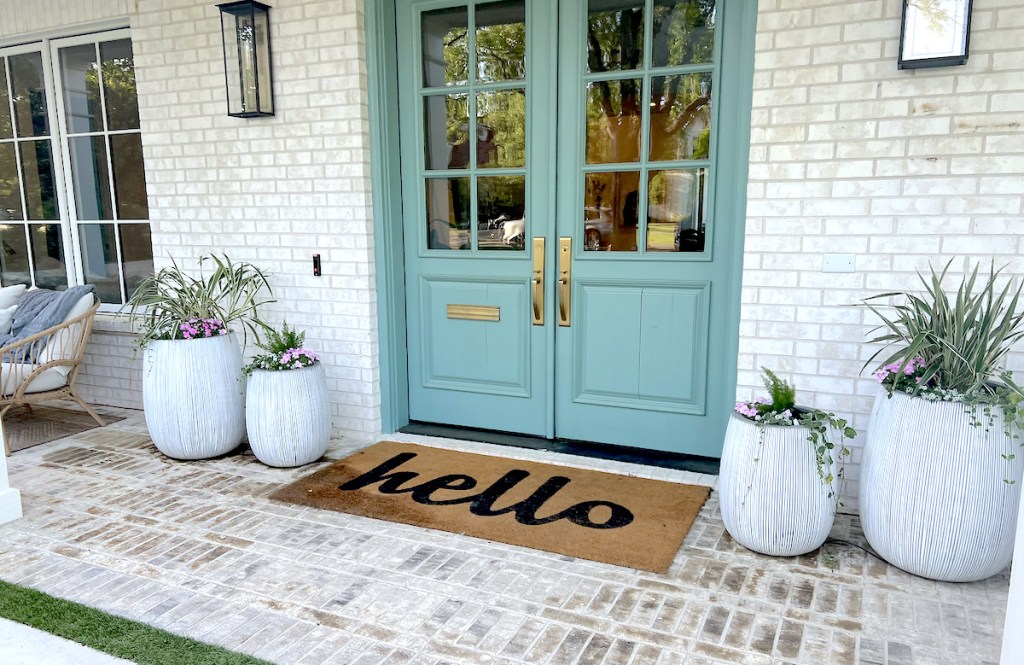 wayfair way day hello doormat in front of double blue front doors