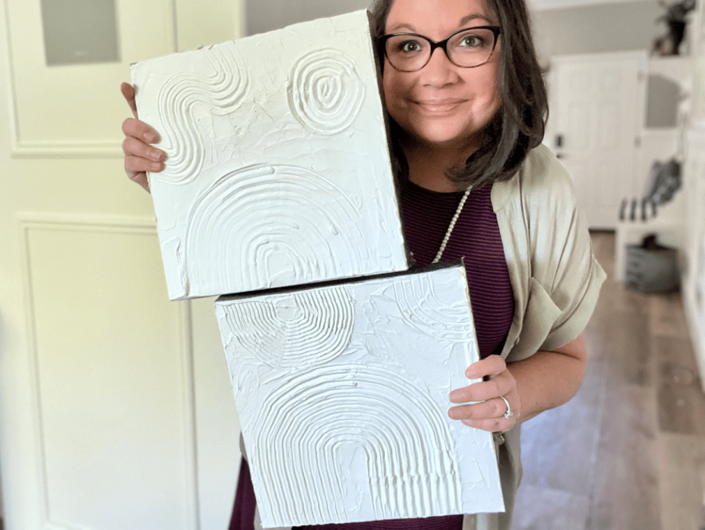 woman holding diy textured art