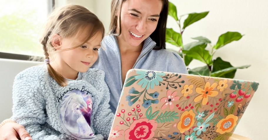 woman and child looking at laptop