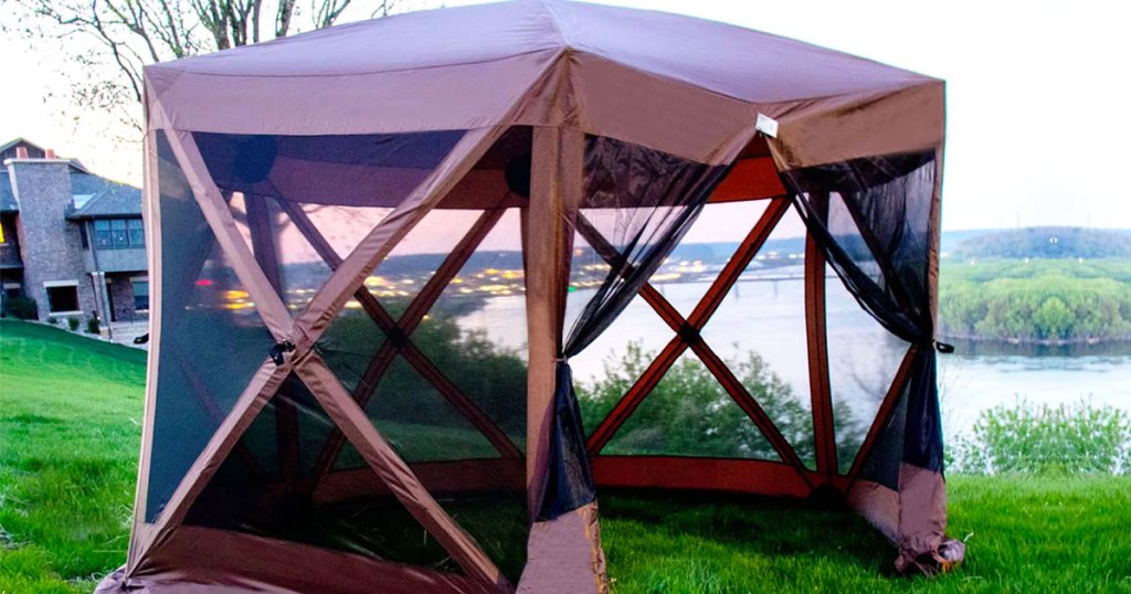 brown pop-up gazebo outdoors near lake