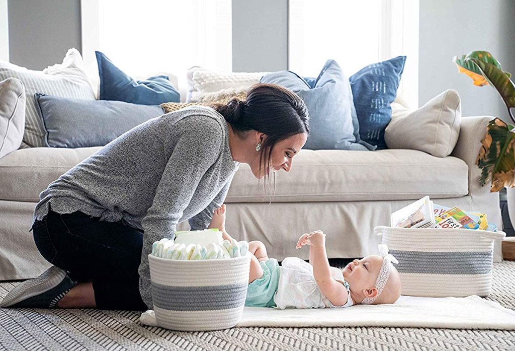 woman sitting by a baby