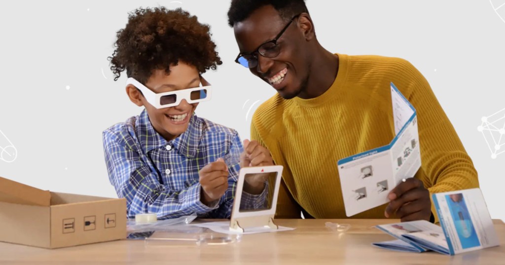 boy and man playing with a Mel Science Kit