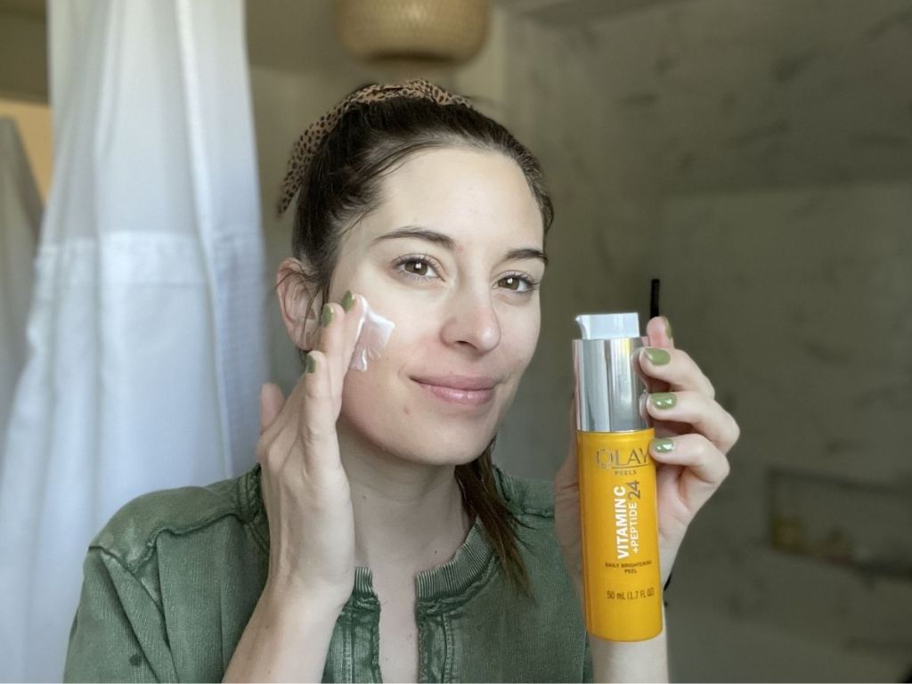 woman applying brightening peel 