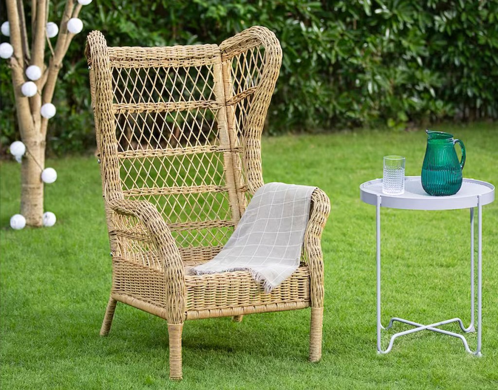 wicker wing chair in grass