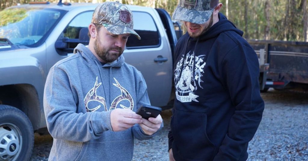 two men in sweatshirts