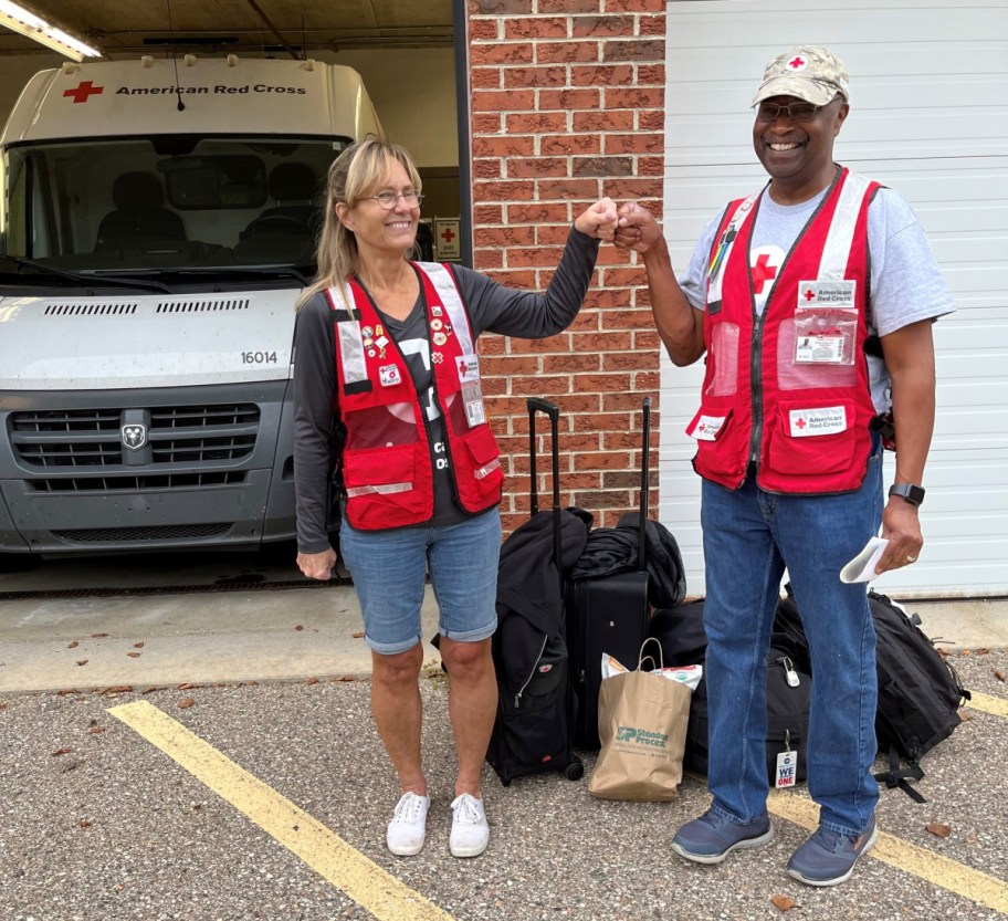 American red cross volunteers demonstrating how to help after a tragedy