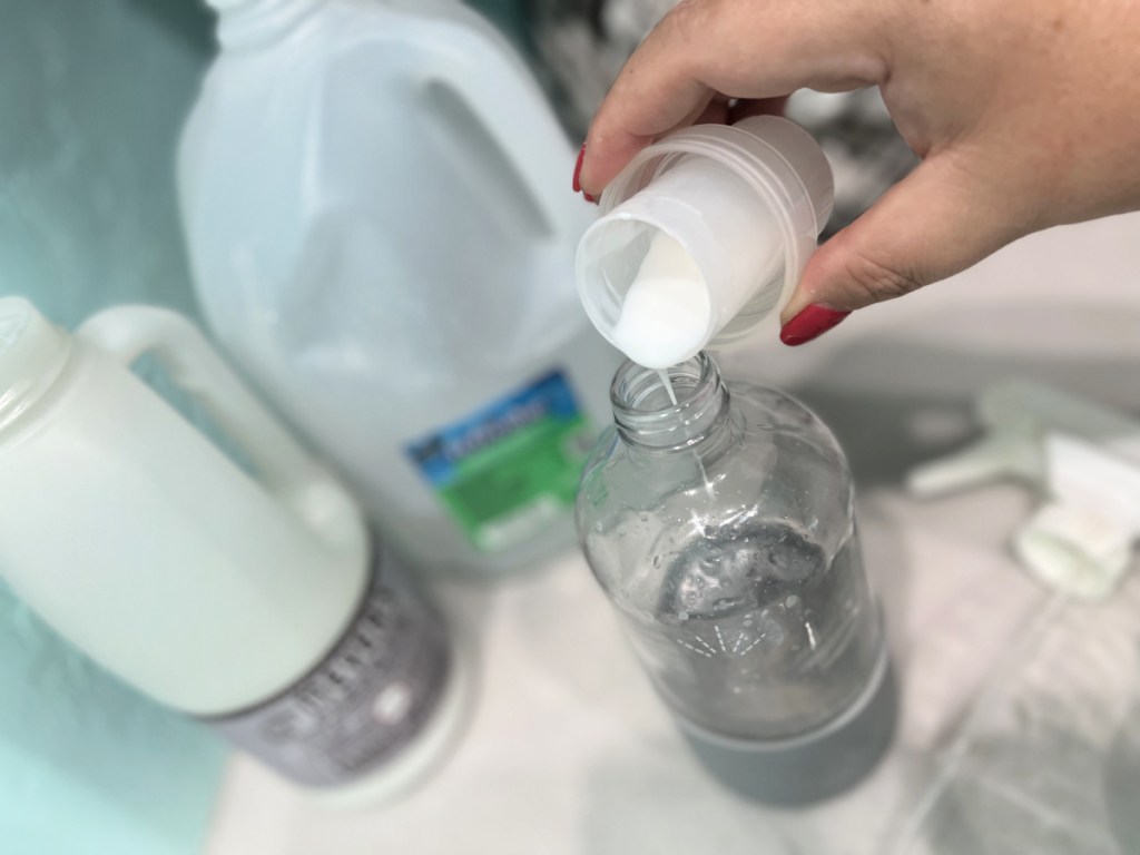 adding fabric softener to spray bottle