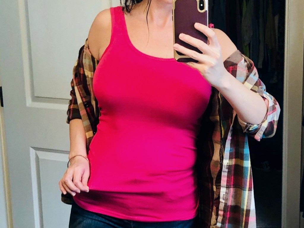 woman in pink tank taking a selfie