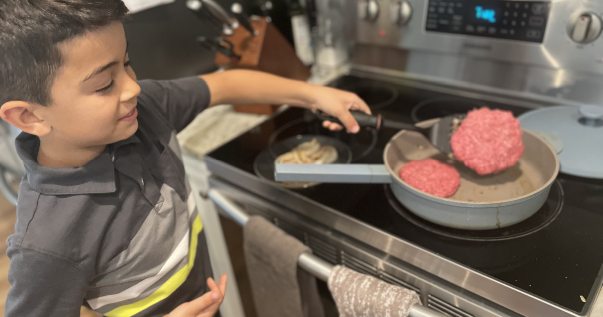 boy flipping burger