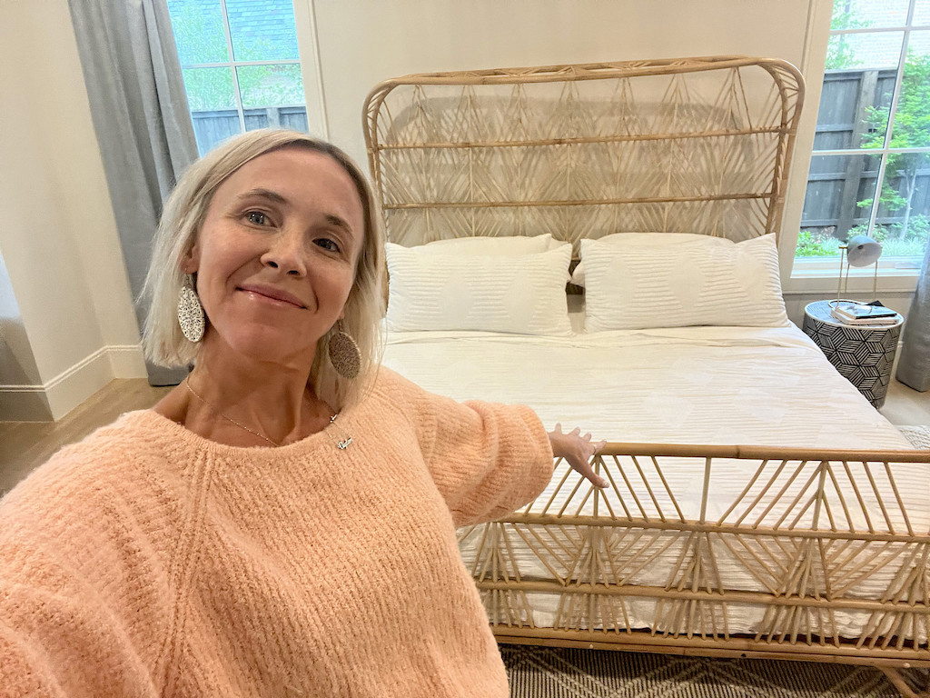 woman pointing at rattan bed