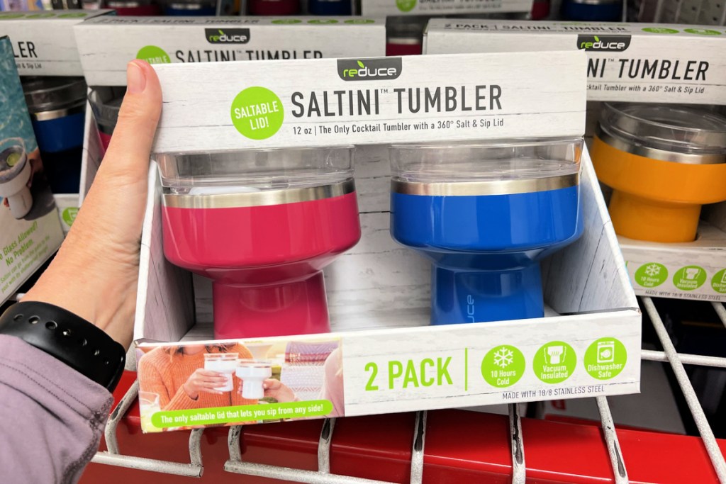 reduce saltini tumblers in hands