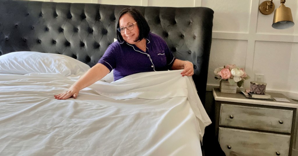 woman in bed with white costco sheets