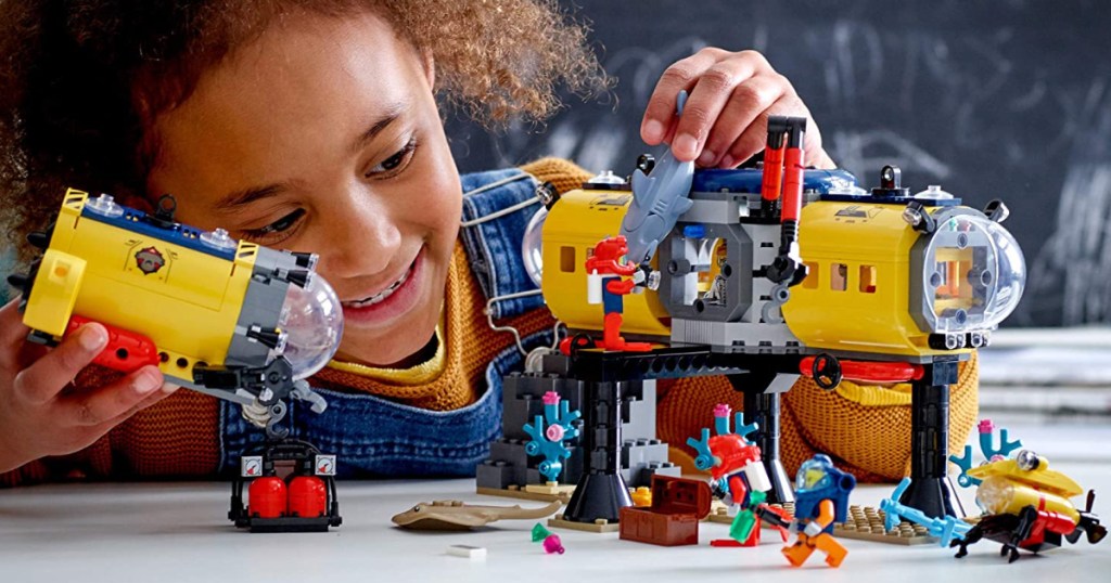 Child playing with LEGO ocean exploration center