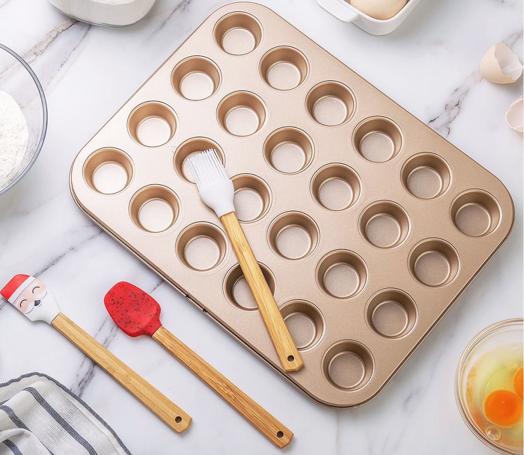 mini muffin pan with spatulas on kitchen counter