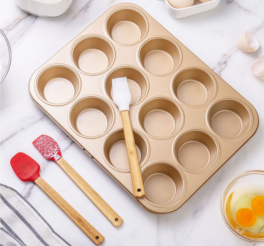 muffin pan with spatulas on kitchen counter