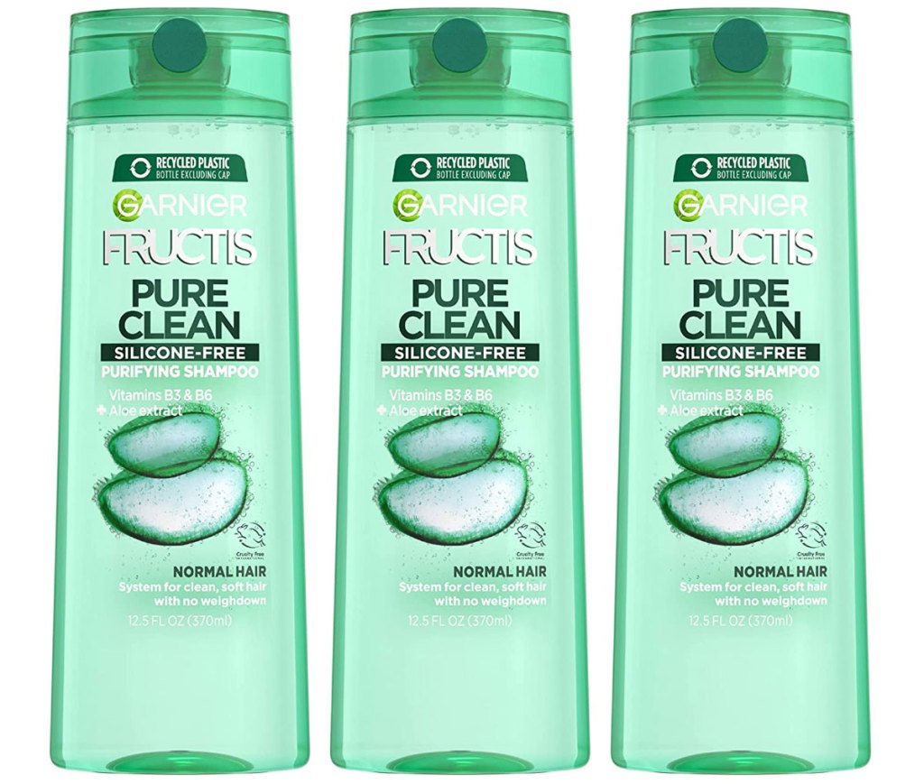 three bottles of garnier shampoo