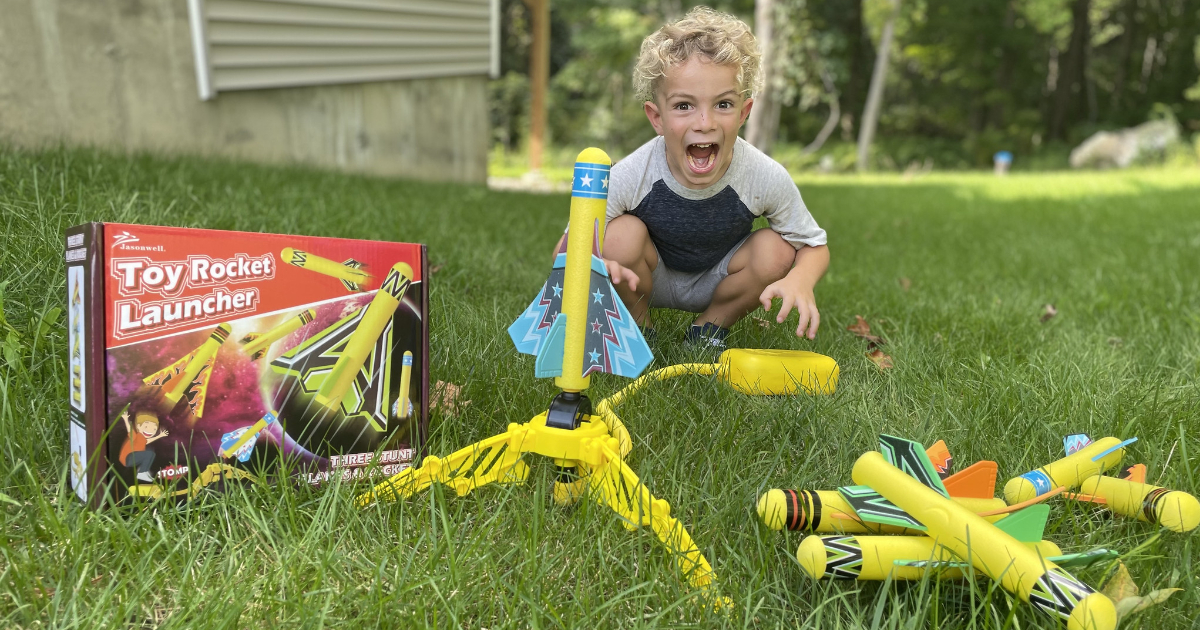 Kid excited in front of Toy Rocket Launcher