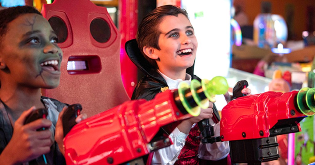 Kids in costumes playing at Chuck E Cheese