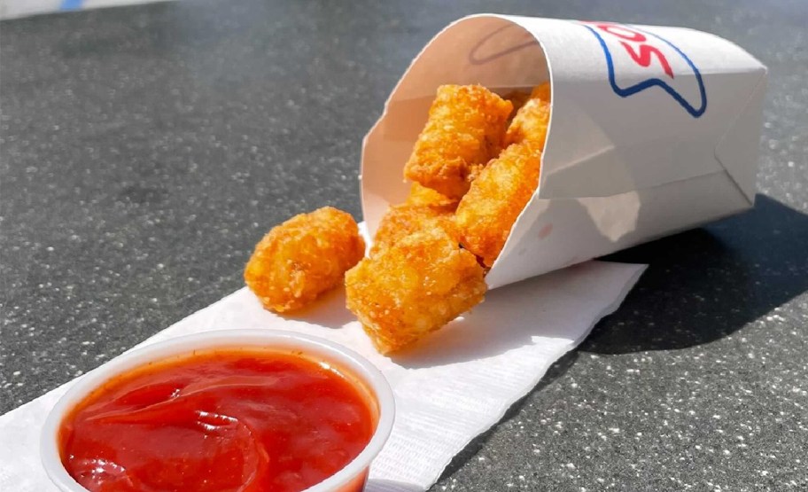 order of Sonic tater tots on napkin next to ketchup