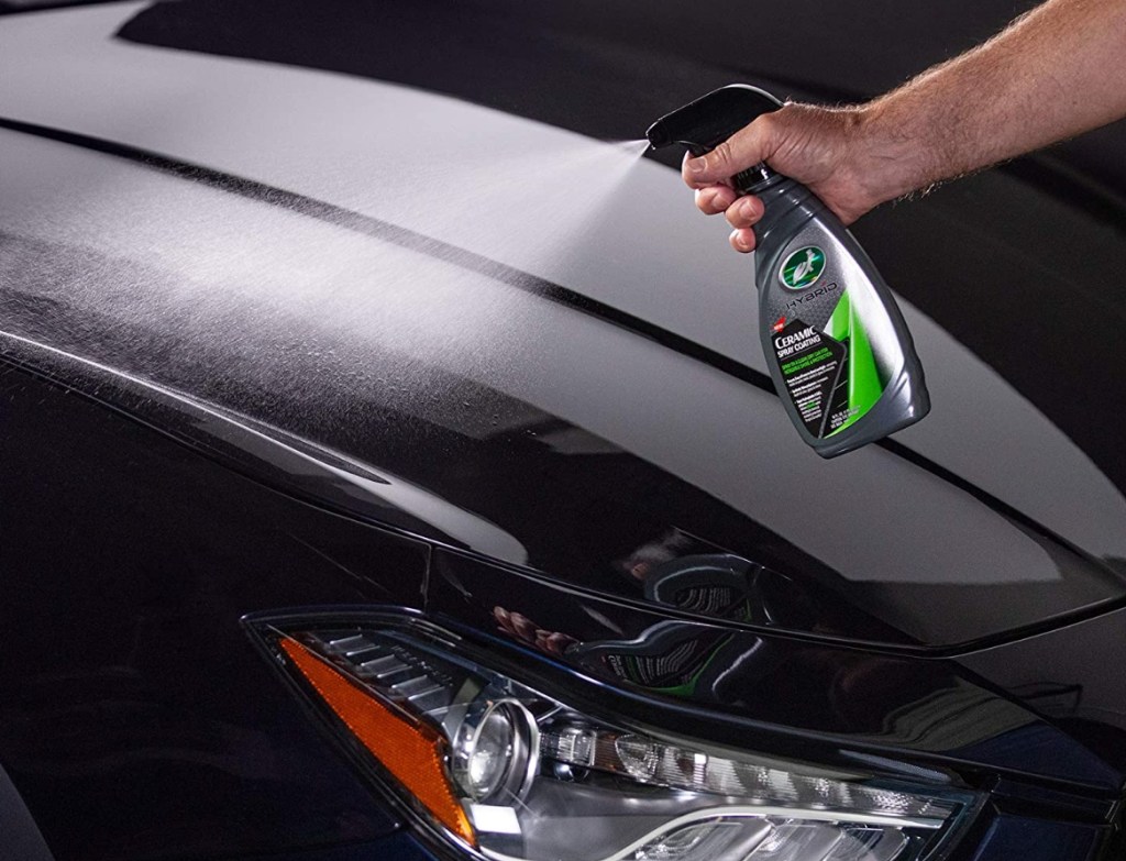 man spraying Turtle Wax Ceramic Spray