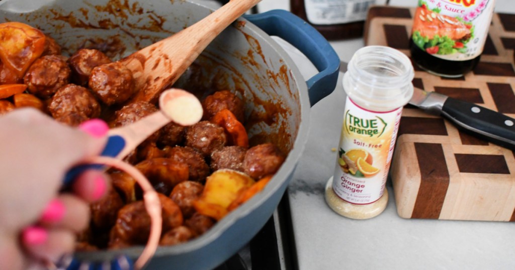 adding orange ginger seasoning