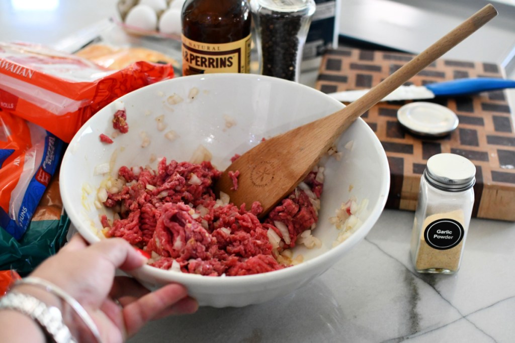 bowl mixing ground beef spices and onions