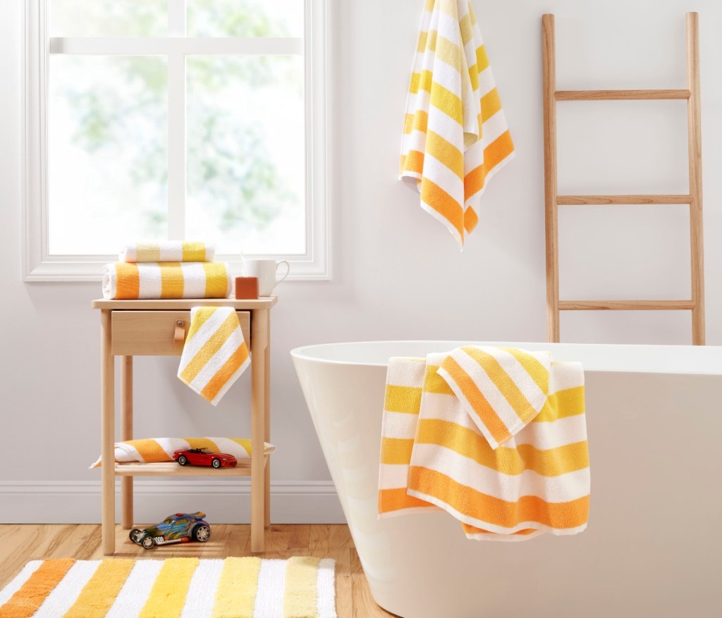 striped yellow bath towels in bathroom