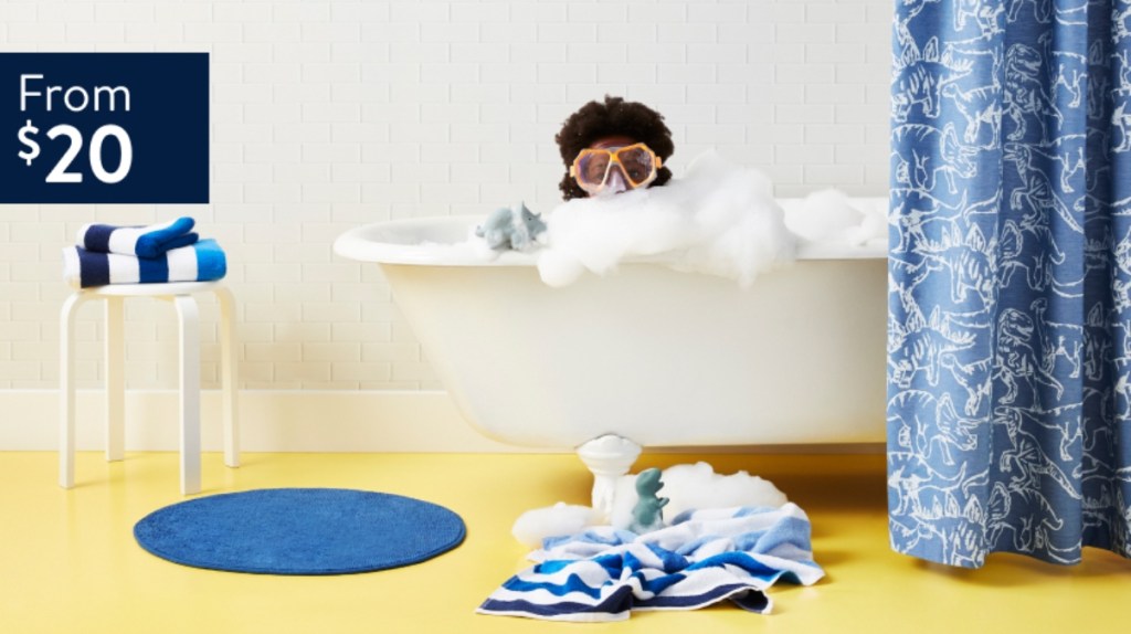 boy wearing goggles in bathtub