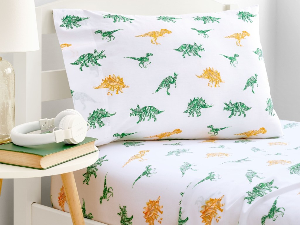 dinosaur sheets on a twin bed