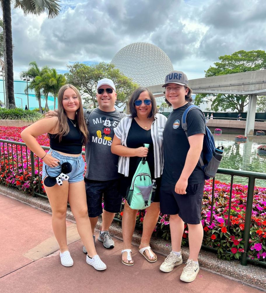 family standing at disney experience gift ideas