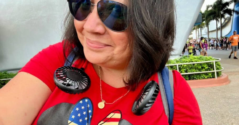 woman wearing a neck fan at disney world