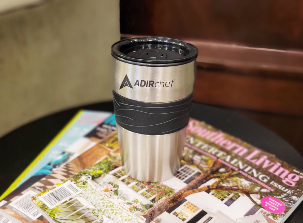 tumbler on stack of magazines