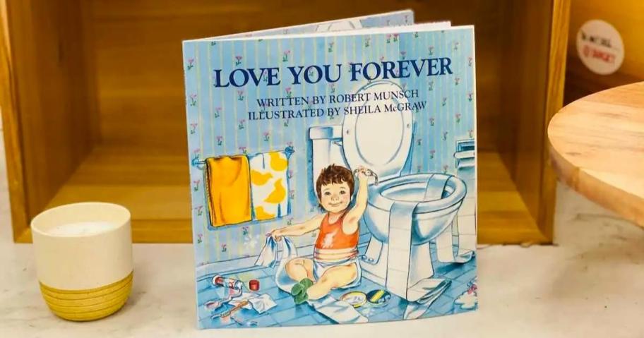 love you forever book standing on marble tabletop