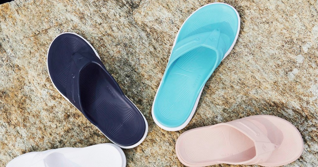 navy, blue, and light pink flip flops