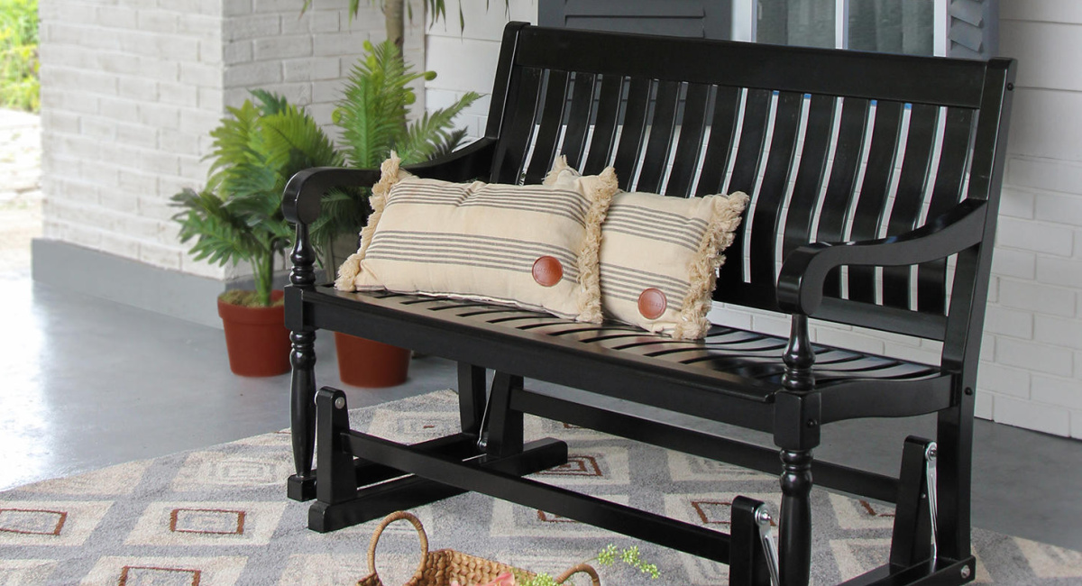 black members mark glider bench outside on a porch