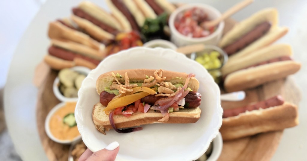 dishing up a hot dog from hot dog bar board