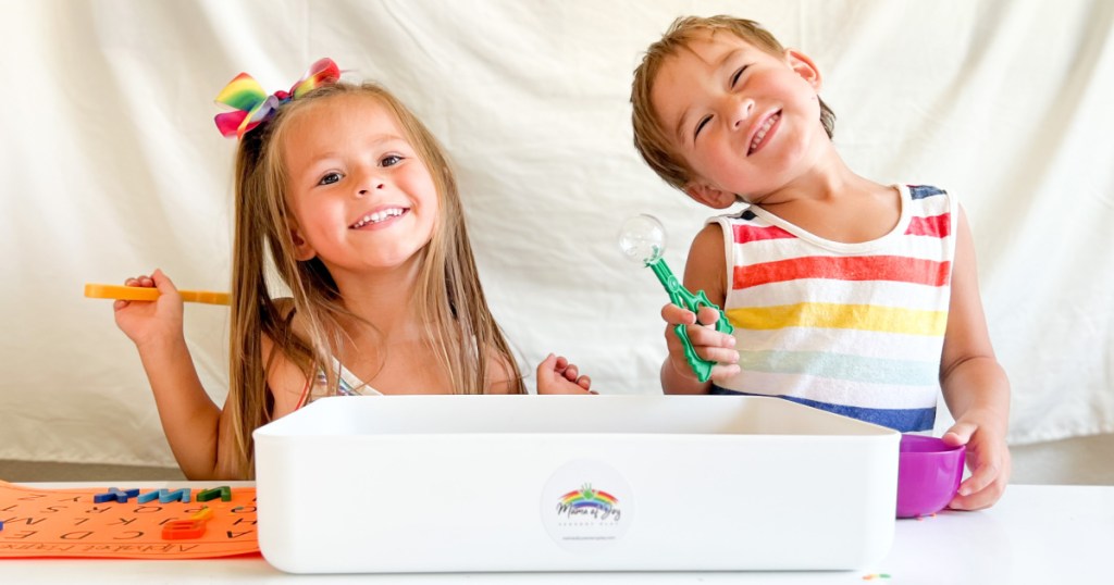 kids playing with sensory bin