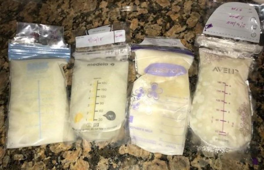 4 bags of breast milk on a granite counter top