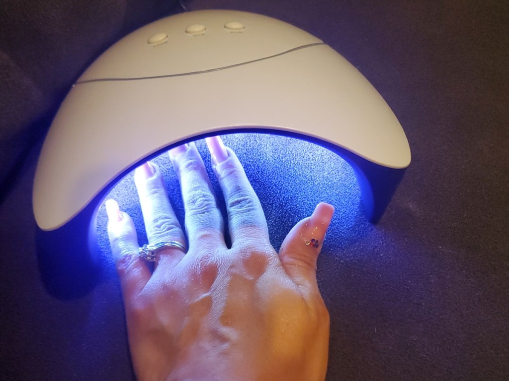 using a UV light to dry gel nails