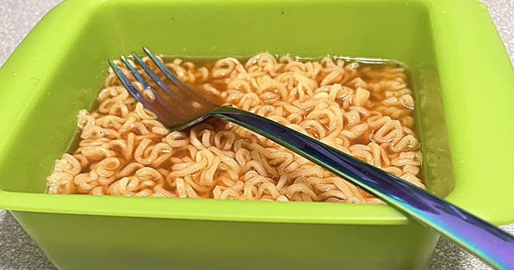 green Ramen cooker filled with Ramen